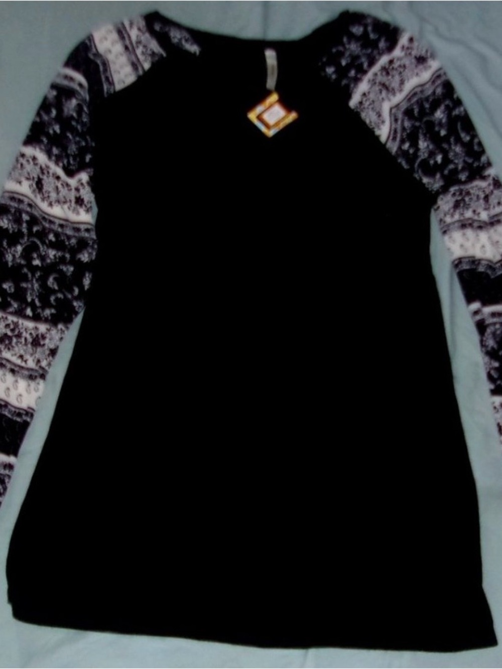 Black Long-Sleeve Raglan Top with Patterned Sleeves